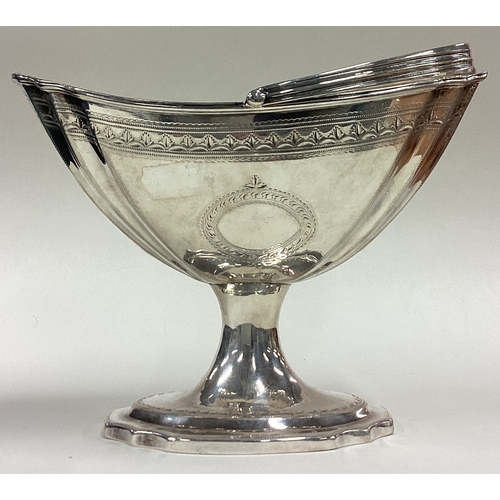 51 - DUBLIN: A large Irish silver swing handled basket with bright-cut decoration. 1795. By William Bond.... 