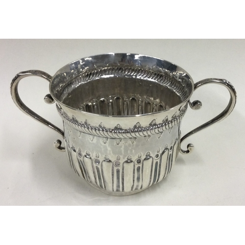 511 - An 18th Century Georgian silver porringer. Approx. 70 grams. Est. £100 - £150.