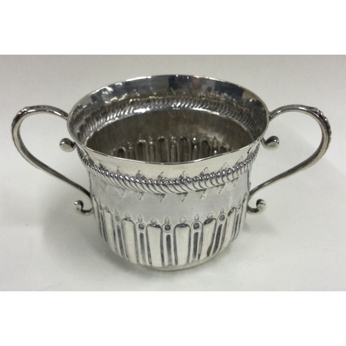 511 - An 18th Century Georgian silver porringer. Approx. 70 grams. Est. £100 - £150.