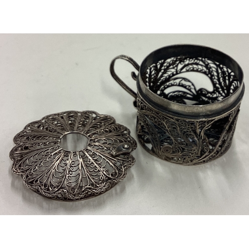 517 - An 18th Century silver filigree bougie box with handle. Approx. 17 grams. Est. £30 - £40.