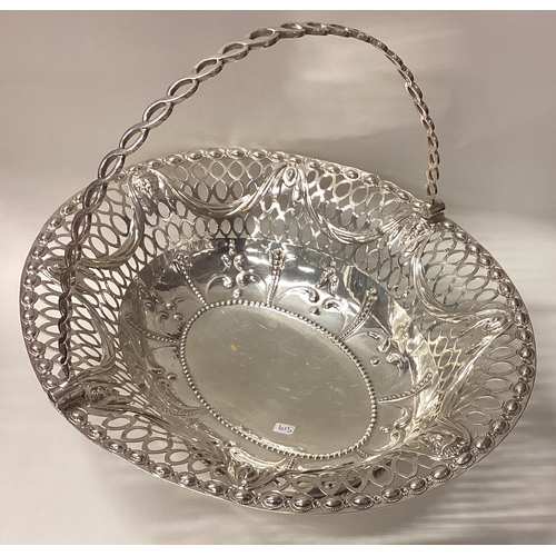 519 - A large 18th Century George III pierced silver basket chased with figural decoration. Fully marked t... 