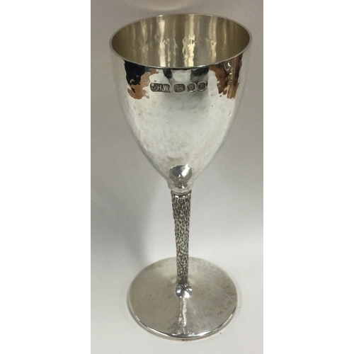 521 - A hammered silver goblet in the Stuart Devlin style. London 1976. By JHW. Approx. 180 grams. Est. £2... 