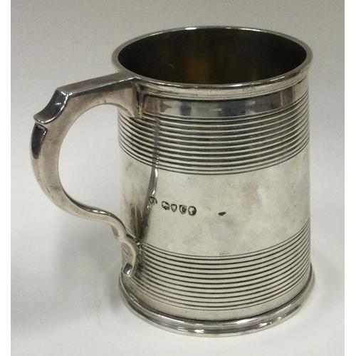 522 - A Victorian silver mug with reeded decoration. London 1878. By William Evans. Approx. 183 grams. Est... 