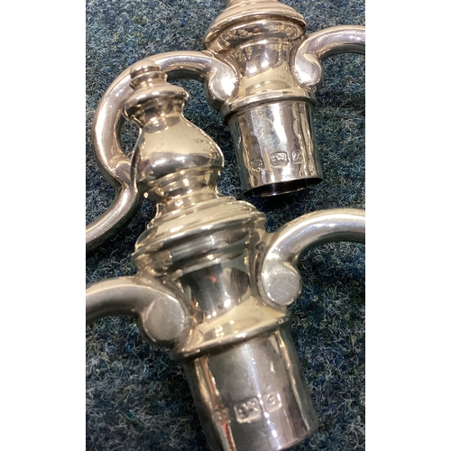 534 - A good pair of silver candelabras in the Georgian style with removable tops. London. By RC. Approx. ... 