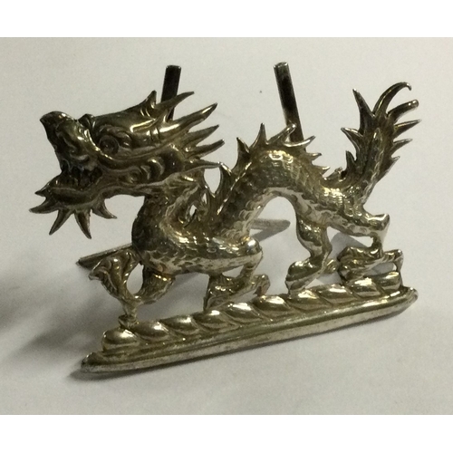 539 - A 19th Century Chinese export silver menu holder in the form of a dragon. By Wang Hing. Approx. 14 g... 