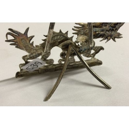 539 - A 19th Century Chinese export silver menu holder in the form of a dragon. By Wang Hing. Approx. 14 g... 