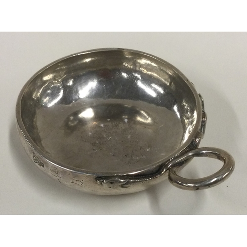 541 - An 18th Century French silver wine taster. Marked to side. Approx. 89 grams. Est. £200 - £300.