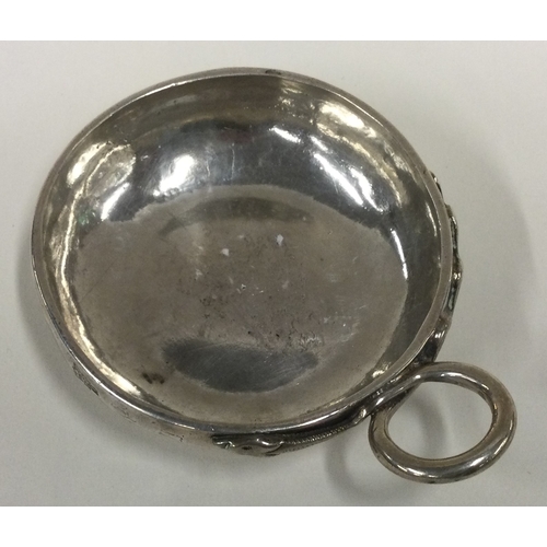 541 - An 18th Century French silver wine taster. Marked to side. Approx. 89 grams. Est. £200 - £300.