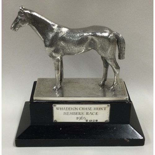 543 - A fine cast silver figure of a horse on plinth. London 1964. By EB. Approx. 306 grams of gross weigh... 