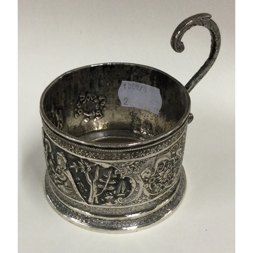 551 - A 19th Century chased silver tea glass holder. Shiraz. Approx. 131 grams. Est. £120 - £150.