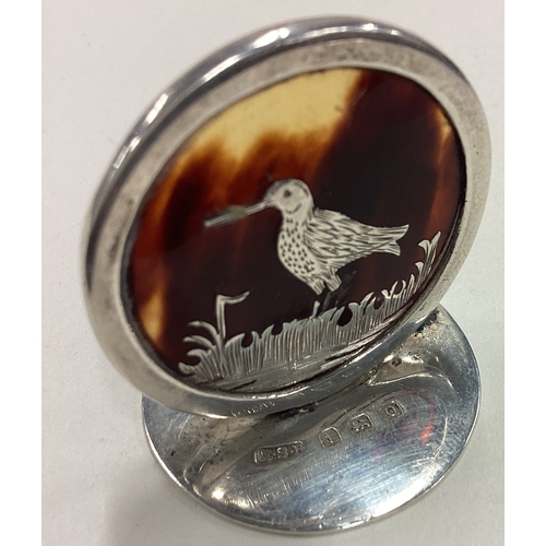 559 - An Edwardian silver and tortoiseshell menu holder depicting a bird. Birmingham 1906. Approx. 12 gram... 