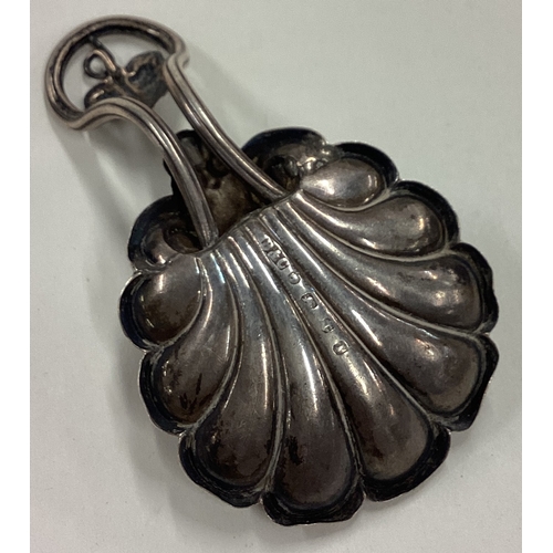 56 - A Victorian silver caddy spoon with cast leaf handle. Birmingham 1857. By Brown & Clark. Approx. 13 ... 