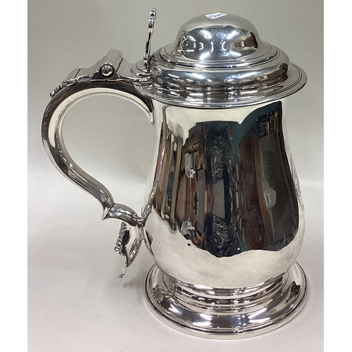 564 - A good quality plain George III silver dome topped tankard with pierced thumb piece to pedestal base... 