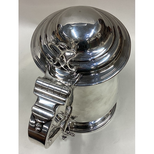 564 - A good quality plain George III silver dome topped tankard with pierced thumb piece to pedestal base... 