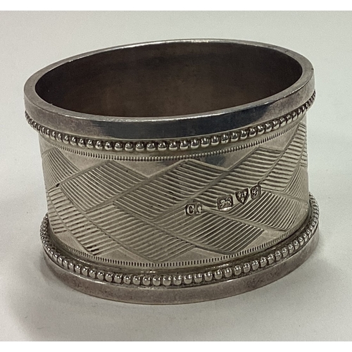 57 - CHESTER: An engine turned silver napkin ring. 1906. By Cohen Charles. Approx. 45 grams. Est. £40 - £... 