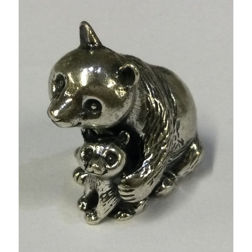 582 - A silver figure of two bears bearing import marks. Marked to base. Approx. 34 grams. Est. £50 - £80.