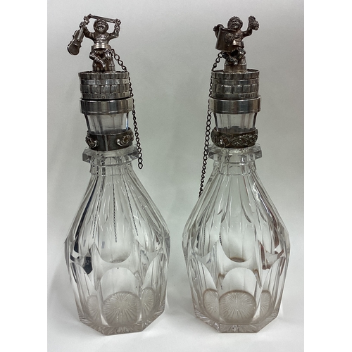 586 - A pair of Russian silver mounted and glass decanters with figural lids. Fully marked. Est. £1200 - £... 