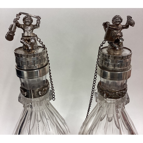 586 - A pair of Russian silver mounted and glass decanters with figural lids. Fully marked. Est. £1200 - £... 