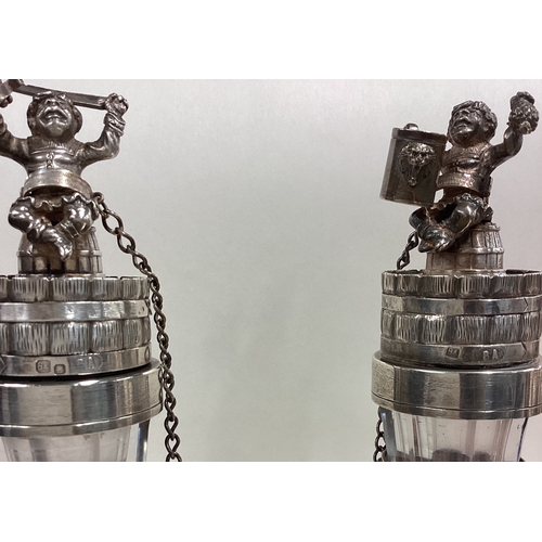 586 - A pair of Russian silver mounted and glass decanters with figural lids. Fully marked. Est. £1200 - £... 