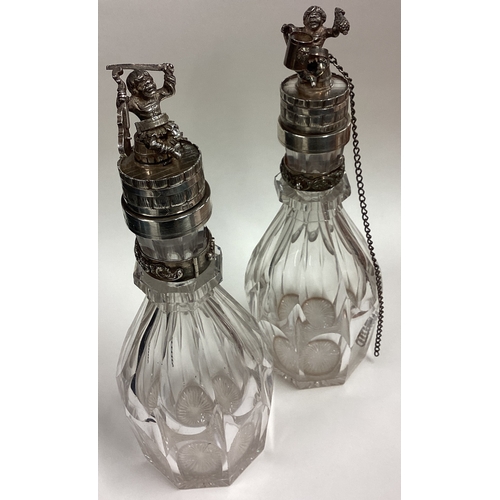 586 - A pair of Russian silver mounted and glass decanters with figural lids. Fully marked. Est. £1200 - £... 