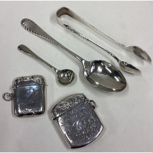 593 - Two good silver vesta cases, tongs etc. Approx. 80 grams. Est. £30 - £50.