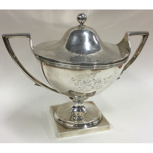 599 - An 18th Century silver sauce tureen with lift-off cover and crested decoration. London 1796. Probabl... 