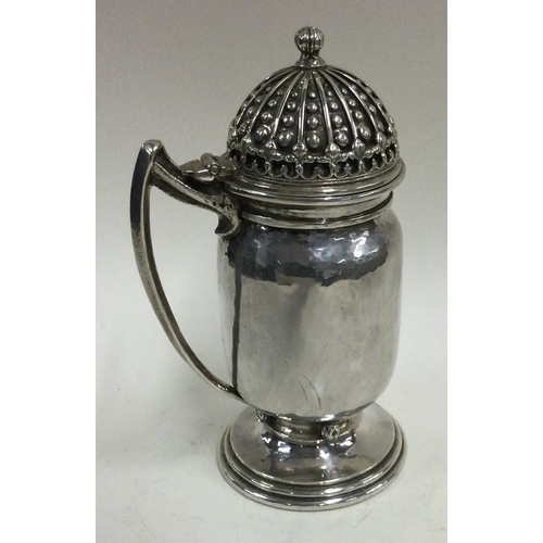 604 - OMAR RAMSDEN: A silver mustard pot with hinged lid to beaded decoration. 1938. Signed 'Omar Ramsden ... 