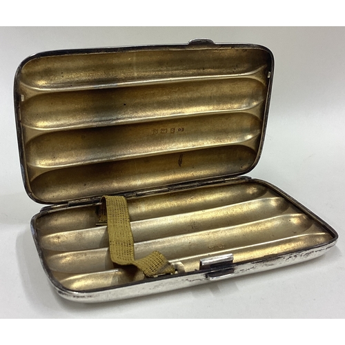 613 - A plain silver four-finger cigar case. Birmingham. Approx. 140 grams. Est. £70 - £80.