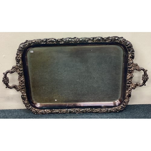 619 - A large heavy silver plated gallery tray with chased border. Est. £20 - £30.