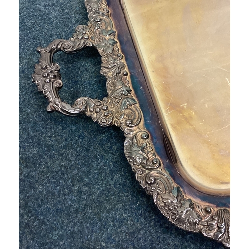 619 - A large heavy silver plated gallery tray with chased border. Est. £20 - £30.