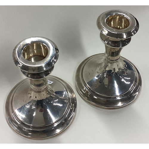 62 - A pair of Art Deco silver candlesticks. Birmingham 1907. By WH Haseler. Approx. 310 grams of gross w... 