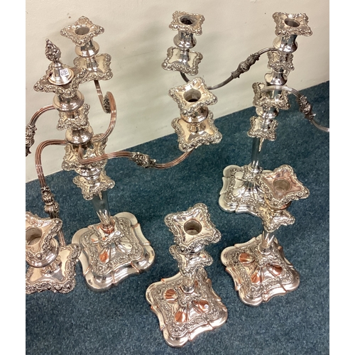 620 - A suite of Old Sheffield Plate candlesticks, centerpiece etc. Est. £60 - £80.