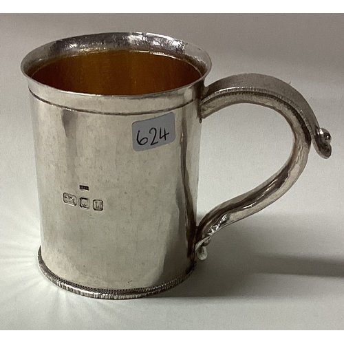 624 - A rare silver christening mug with hammered design. London 1994. By Michael Bolton. Approx. 110 gram... 