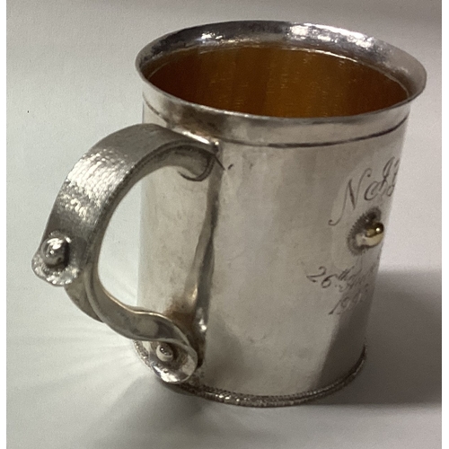 624 - A rare silver christening mug with hammered design. London 1994. By Michael Bolton. Approx. 110 gram... 