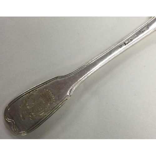 638 - An 18th Century French silver spoon with crested decoration. Approx. 90 grams. Est. £100 - £150.