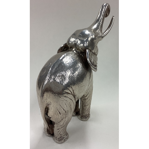 64 - A rare and large Sterling silver figure of an elephant. Approx. 196 grams. Est. £200 - £300.