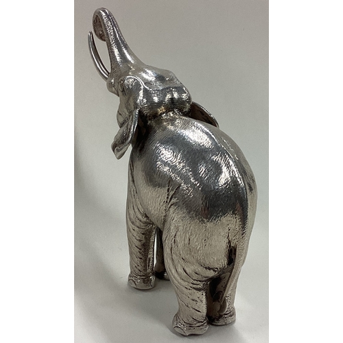 64 - A rare and large Sterling silver figure of an elephant. Approx. 196 grams. Est. £200 - £300.