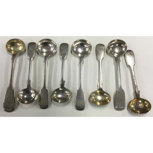 658 - A collection of eight silver fiddle pattern salt spoons. Various dates and makers. Approx. 98 grams.... 