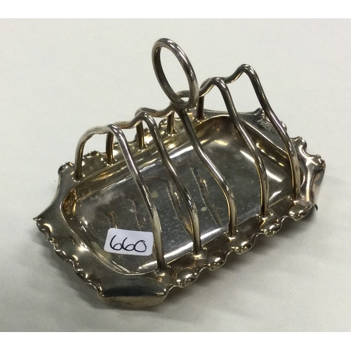 660 - A silver toy toast rack on stand. Birmingham 1901. By Joseph Gloster & Sons. Approx. 34 grams. Est. ... 