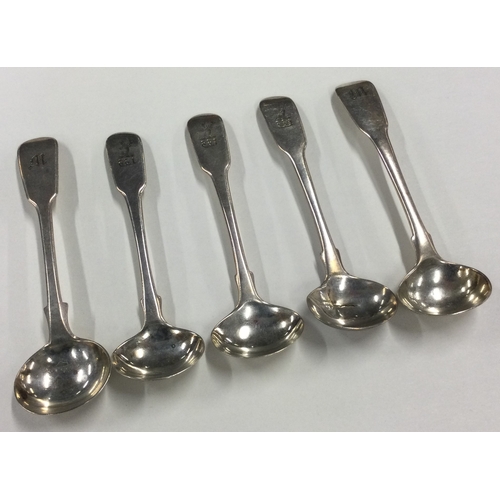 666 - A set of three silver fiddle pattern salts spoons together with two others. Various dates and makers... 