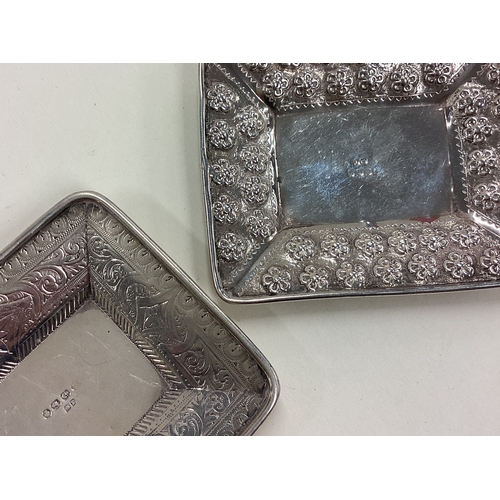 67 - A pair of Victorian silver counter dishes. Birmingham 1894. Approx. 51 grams. Est. £60 - £80.