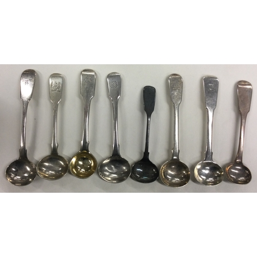 670 - A group of eight silver fiddle pattern salt spoons. Various dates and makers. Approx. 84 grams. Est.... 