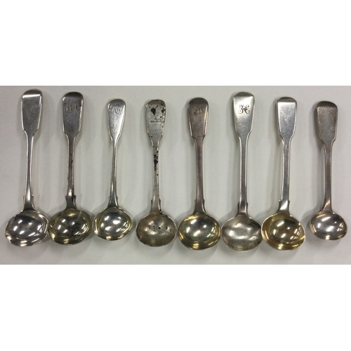 681 - A group of eight silver fiddle pattern salt spoons. Various dates and makers. Approx. 96 grams. Est.... 