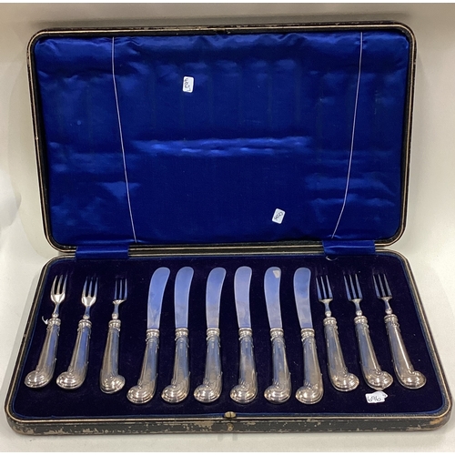 696 - A good boxed set of six plus six silver handled cake knives and forks. Est. £40 - £50.