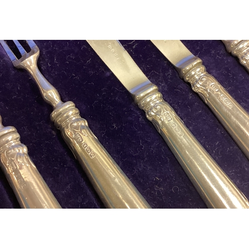 696 - A good boxed set of six plus six silver handled cake knives and forks. Est. £40 - £50.