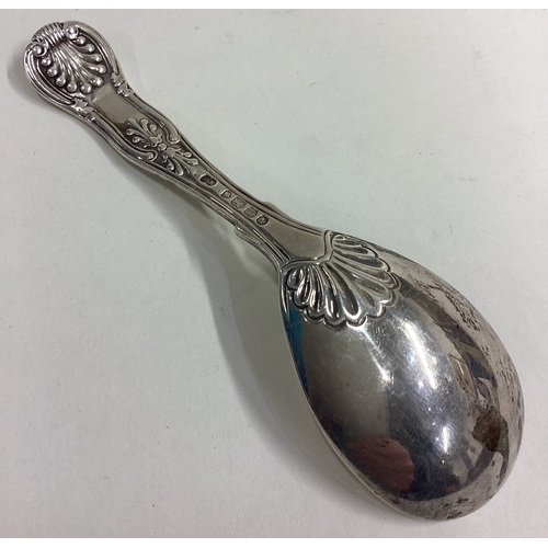 698 - A large silver honeysuckle pattern caddy spoon. London. By GA. Approx. 29 grams. Est. £30 - £50.