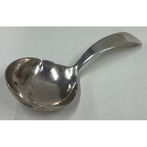 699 - DUBLIN: A Georgian silver OE pattern caddy spoon of plain form. By W Peter. Approx. 19 grams. Est. £... 