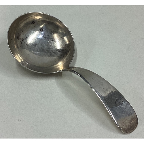 699 - DUBLIN: A Georgian silver OE pattern caddy spoon of plain form. By W Peter. Approx. 19 grams. Est. £... 