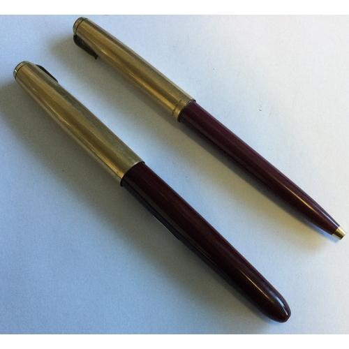 717 - PARKER: A small gold mounted fountain pen together with one other. Est. £40 - £60.