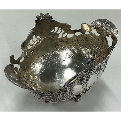 9 - A chased silver basket with pierced decoration. Approx. 143 grams. Est. £120 - £150.